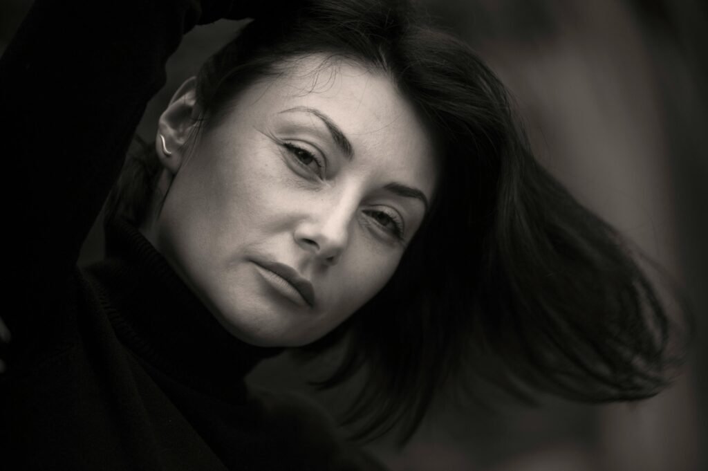 Monochrome portrait of an adult woman with a thoughtful expression.