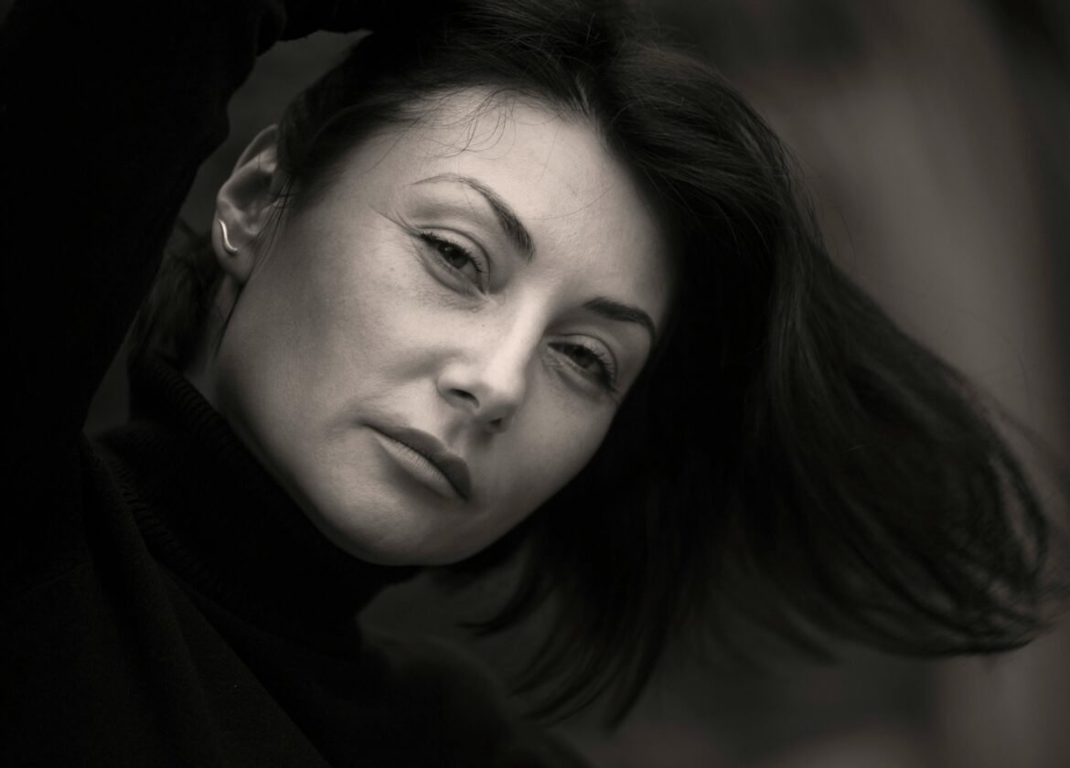 Monochrome portrait of an adult woman with a thoughtful expression.