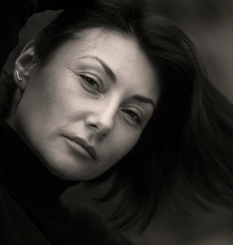 Monochrome portrait of an adult woman with a thoughtful expression.